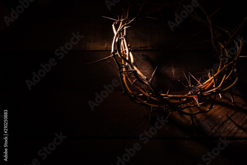 Leinwand Poster An authentic crown of thorns on a wooden background. Easter Theme
