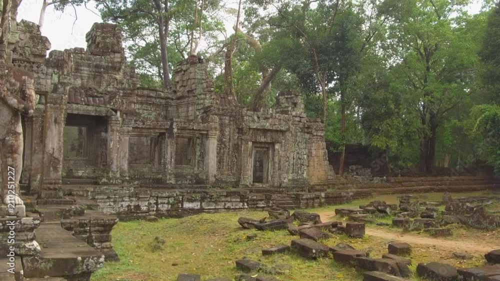 CLOSE UP: Old Buddhist temple complex remnants decaying in quiet green ...