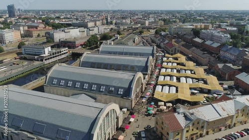 Central market in Riga city historical Europe town living houses and building with roads and cars traffic Drone flight photo