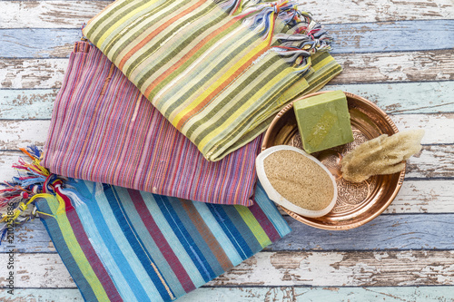 Turkish bath set with peshtemals, sponge, natural soap, and scrubber brush photo