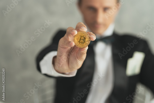 Hand of business man show bitcoin