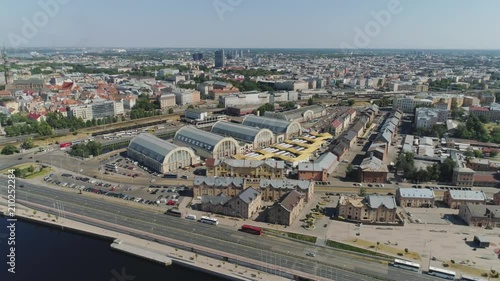 Central market in Riga city historical Europe town living houses and building with roads and cars traffic Drone flight photo