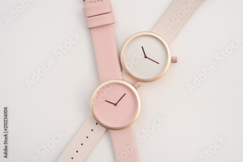 close up of pink wrist watches isolated on white background