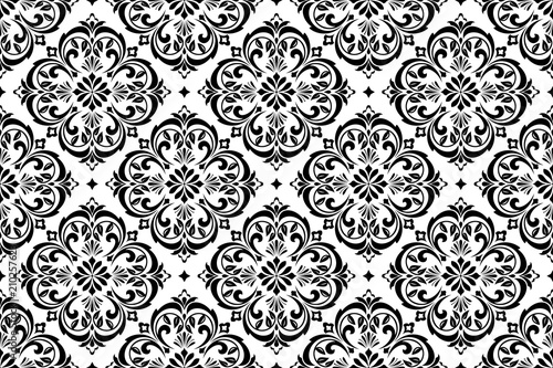 Wallpaper in the style of Baroque. A seamless vector background. White and black floral ornament. Graphic pattern for fabric, wallpaper, packaging. Ornate Damask flower ornament