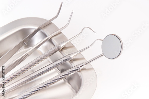 Set of dental stainless tools used by dentists in stomatology office