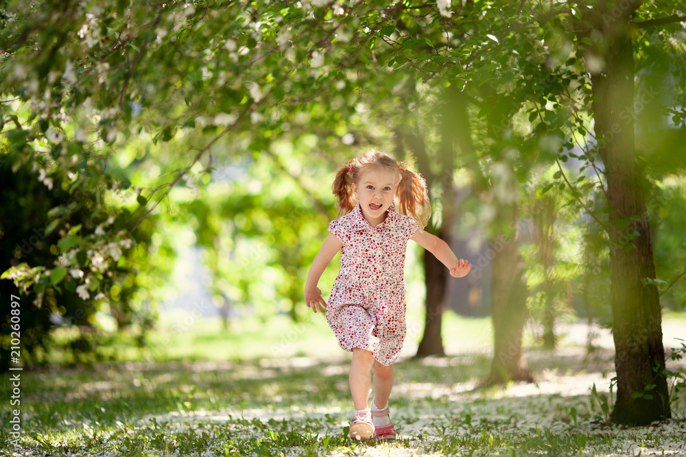 Little cute girl walking in summer park Little cute girl walking in summer park