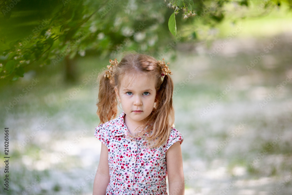 Little cute girl walking in summer park Little cute girl walking in summer park