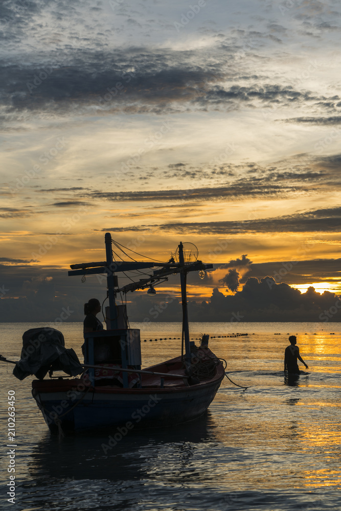 Fisherman prepare to work in dawn
