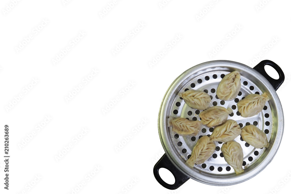 Closeup Shot of Yummy Chinese Dumpling in A Stainless Steel Steamer Isolated on White Background (Clipping Path / Selection Path Included) with Copy Space for Text. Closeup Shot of Yummy Chinese Dumpling in A Stainless Steel Steamer Isolated on White Background (Clipping Path / Selection Path Included) with Copy Space for Text.
