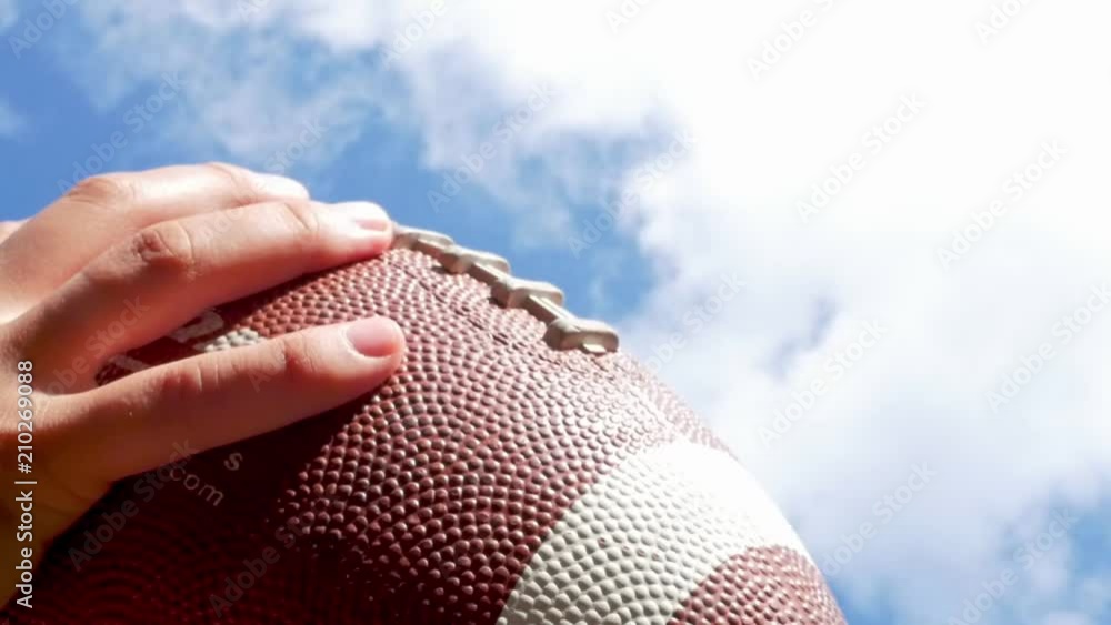 hands catching rugby, football ball, slow motion Stock Video Adobe Stock