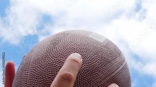 hands catching rugby, football ball, slow motion