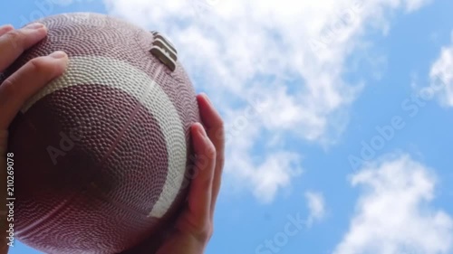 hands catching rugby, football ball, slow motion