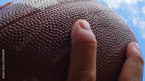 hands catching rugby, football ball, slow motion