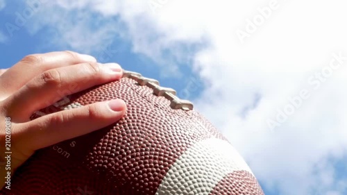 hands catching rugby, football ball, slow motion