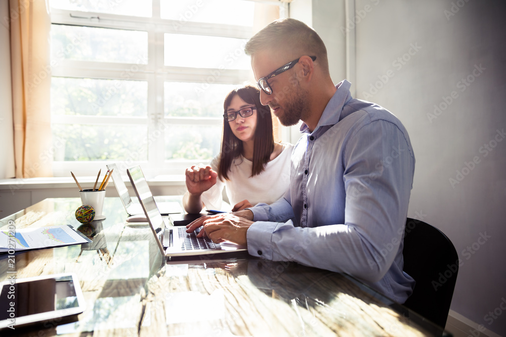 Two Businesspeople Working In Office Two Businesspeople Working In Office