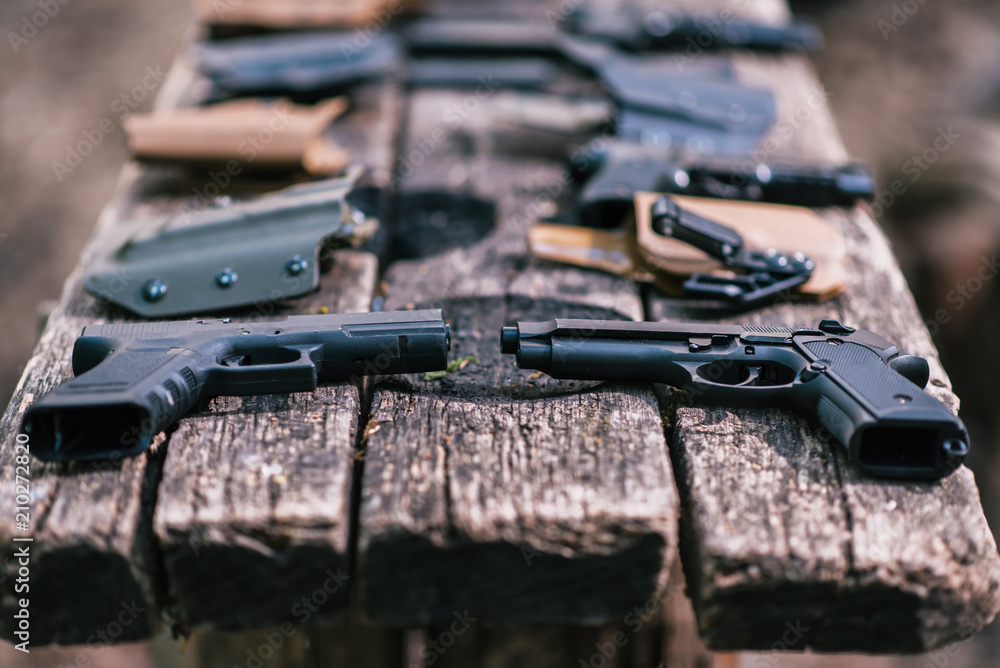 Guns for shooting sports lie on the old table Guns for shooting sports lie on the old table