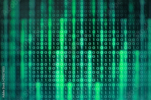 power of big data. binary code information bit on computer monitor screen display. green light text number one and zero. blur defocus blue bokeh light. technology graphic design background concepts