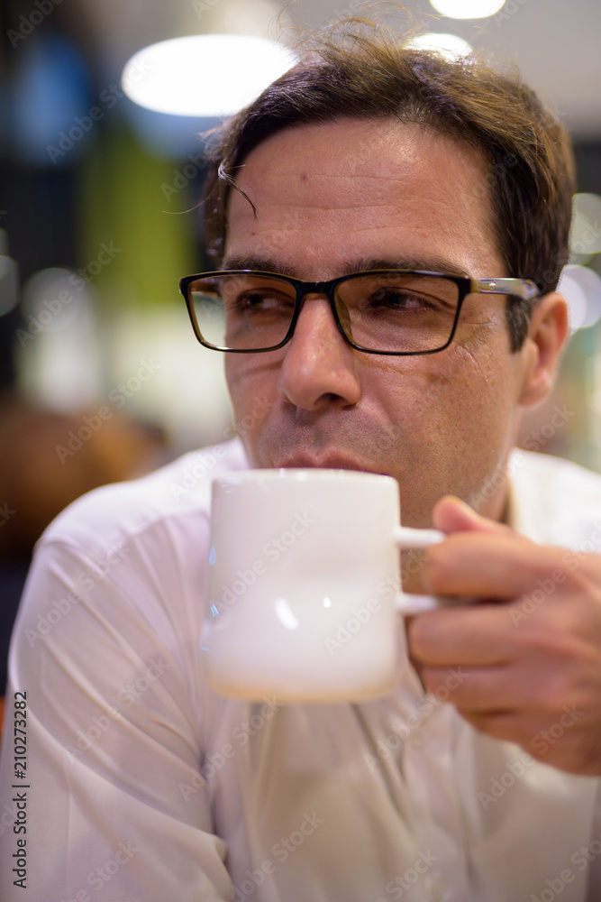 Man drinking coffee in coffee shop Man drinking coffee in coffee shop