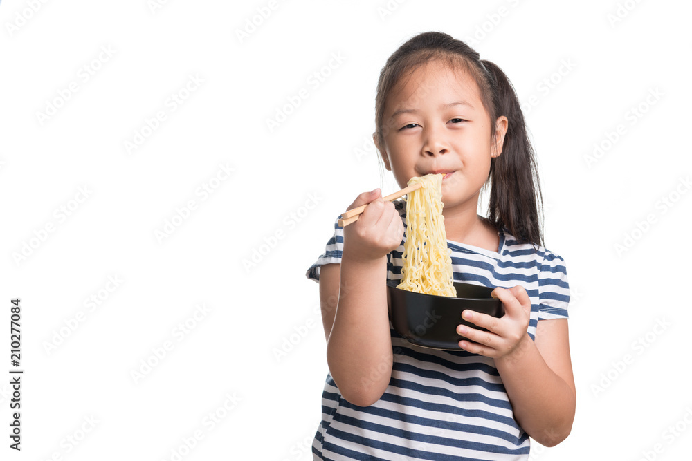 Asian child girl age 7 year , eating Instant noodles on white background Asian child girl age 7 year , eating Instant noodles on white background