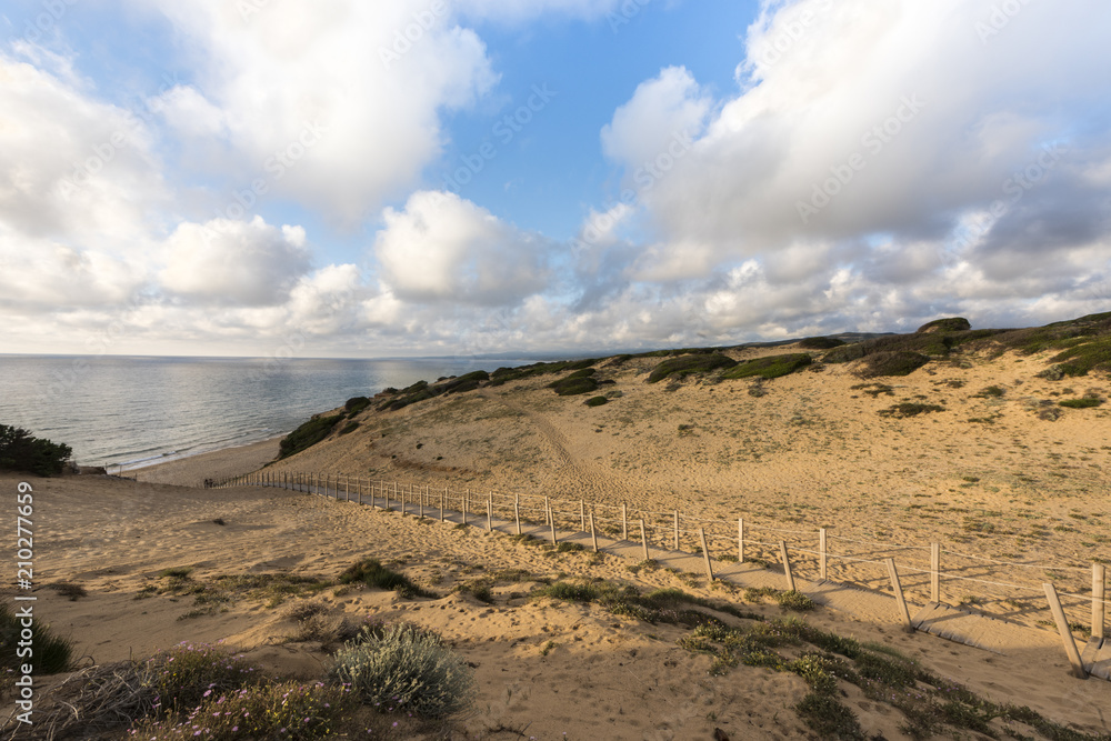 Boardwalk in the sand dunes of beautiful Scivu beach - the green coast 