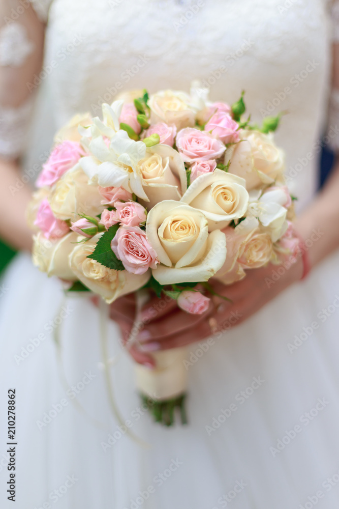 Wedding bouquet of flowers including Red hypericum, Roses, Lilies of the valley, mini Roses, Seeded Eucalyptus, Astilbe, Scabiosa, Pieris, and ivy Wedding bouquet of flowers including Red hypericum, Roses, Lilies of the valley, mini Roses, Seeded Eucalyptus, Astilbe, Scabiosa, Pieris, and ivy