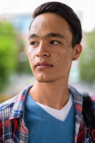 Young handsome Indian man exploring the city of Bangkok, Thailan