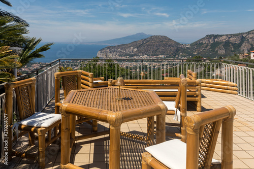 Chairs and table on the terrace overlooking the Bay of Naples and Vesuvius. Sorrento. Italy
