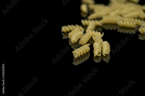 Spaheti, macaroni on a black background
