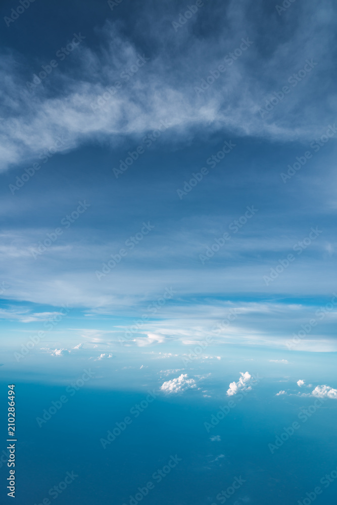 View of white clouds in blue sky from above View of white clouds in blue sky from above