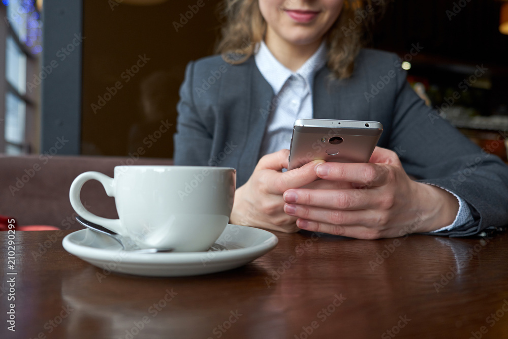 Woman business with smart phone and coffee in cafe. Woman business with smart phone and coffee in cafe.