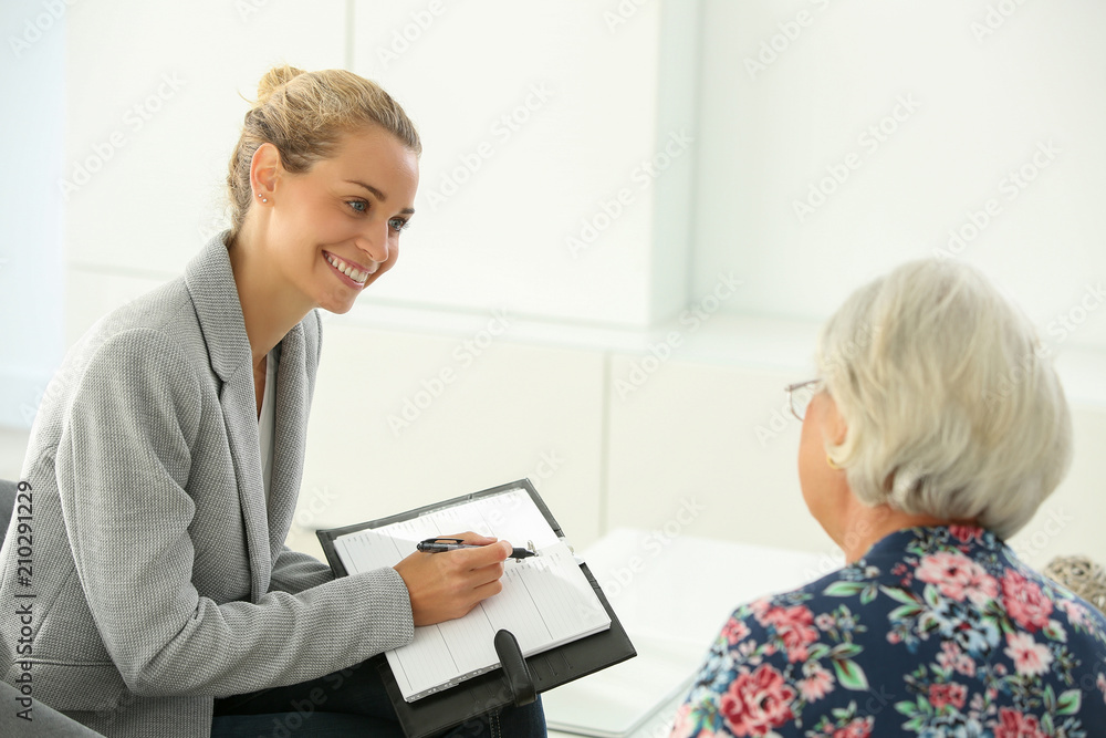 female realtor with retired woman female realtor with retired woman