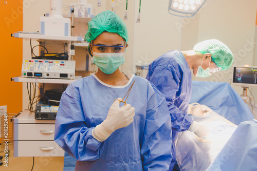 The surgical team is performing surgery for the patients in the operating room