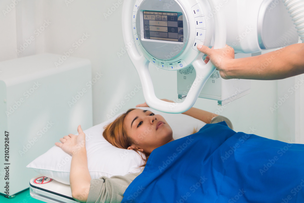 Asian male radiologist preparing and setting up X-rays. Asian male radiologist preparing and setting up X-rays.