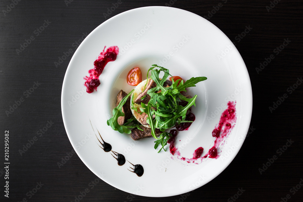 European international fusion cuisine, a beautiful dish on a white plate decorated with herbs and vegetables. a professional chef has prepared a delicious meal. European international fusion cuisine, a beautiful dish on a white plate decorated with herbs and vegetables. a professional chef has prepared a delicious meal.