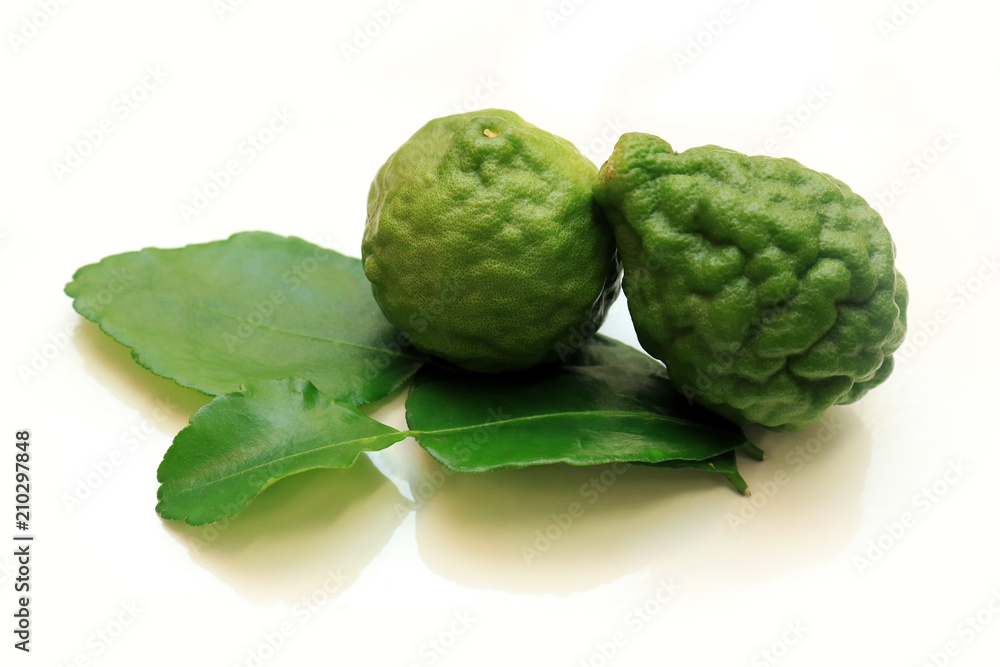 Bergamots (Kaffir lime) with leaf isolated in white background. Bergamots (Kaffir lime) with leaf isolated in white background.