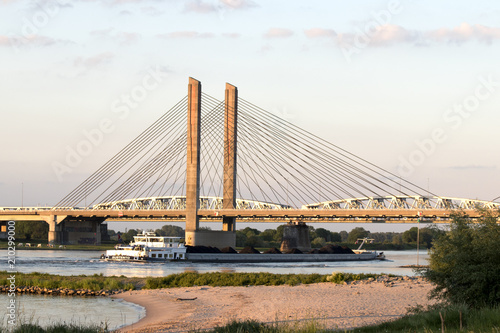 Cable-stayed Martinus Nijhoffbridge over river Waal photo