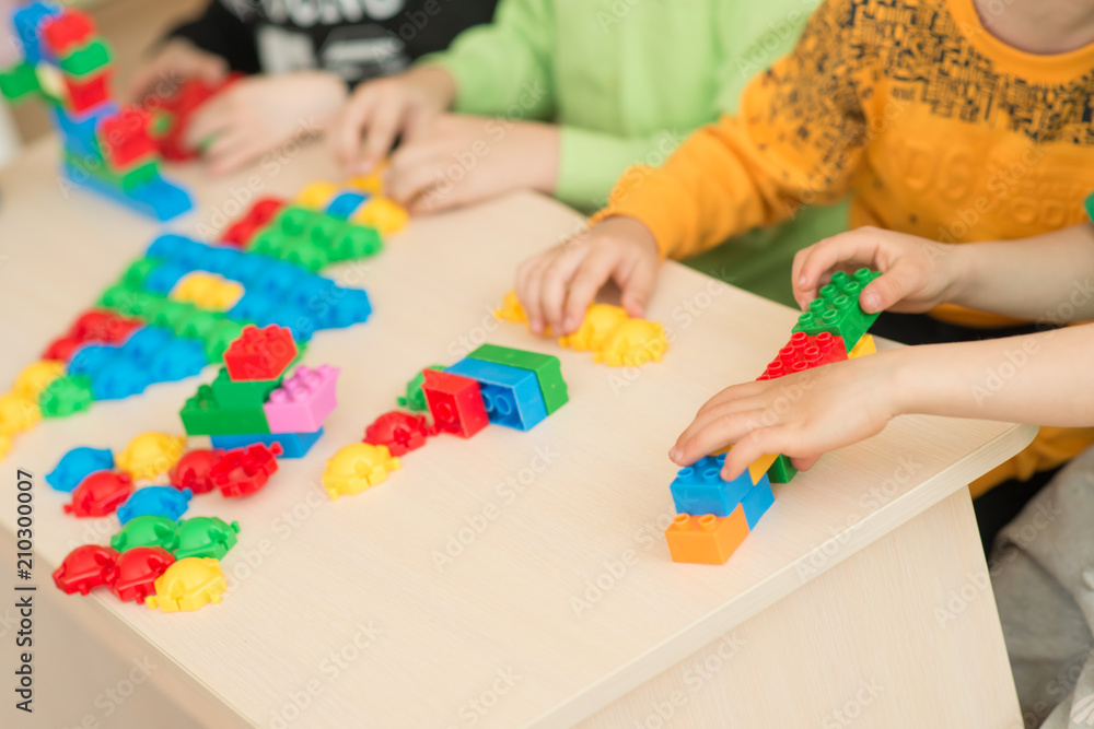 © beshtanya - kids playing with puzzle, education concept © beshtanya - kids playing with puzzle, education concept