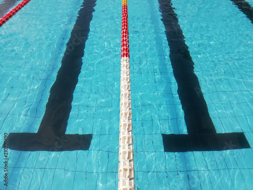 blue swimming pool background, with black lane