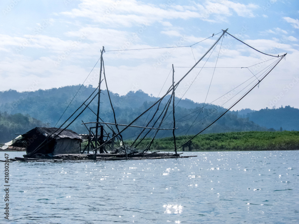 Fishing boat on the river, Fisherman raft village at the river in Sangkhlaburi of Thailand