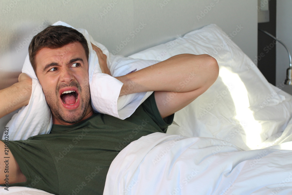 Insane man screaming in bed Stock Photo | Adobe Stock