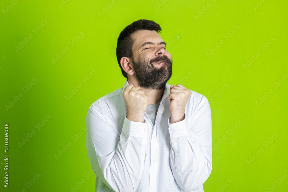 Portrait Of Happy Young Man Showing Thumb Up and victory sign Portrait Of Happy Young Man Showing Thumb Up and victory sign