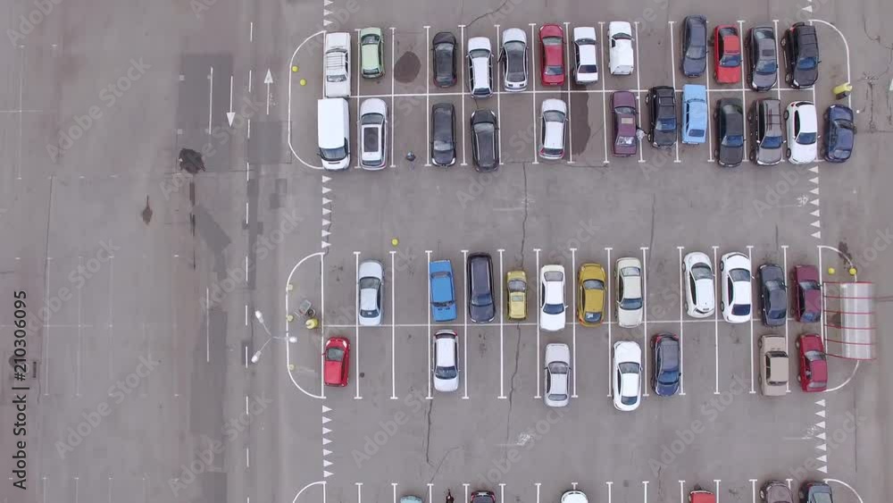 Aerial top-down view of parking lot near city mall Aerial top-down view of parking lot near city mall