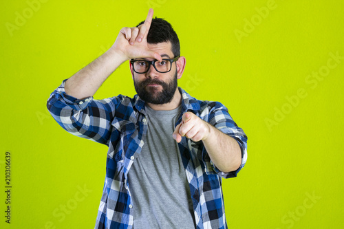 Fotografija Person making loser sign