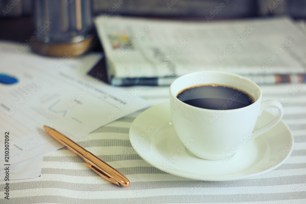Coffee cup on working table in the morning Coffee cup on working table in the morning