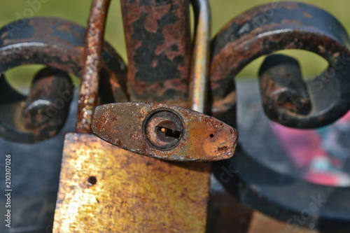 Old Love Padlocks on a barrier in Warsaw.