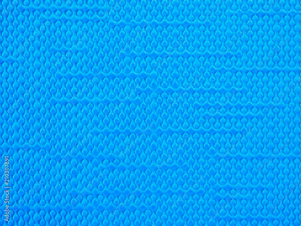 Fototapeta premium Close-up of the blue bubbly wavy plastic surface texture for background and wallpaper. High-quality macro photography.
