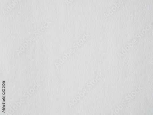 Close-up of the white colour paper or whatman or carton surface texture. Watercolour paper texture for background and wallpaper. High quality macro photography.