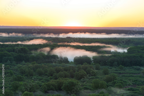 fog at sunrise over the river photo