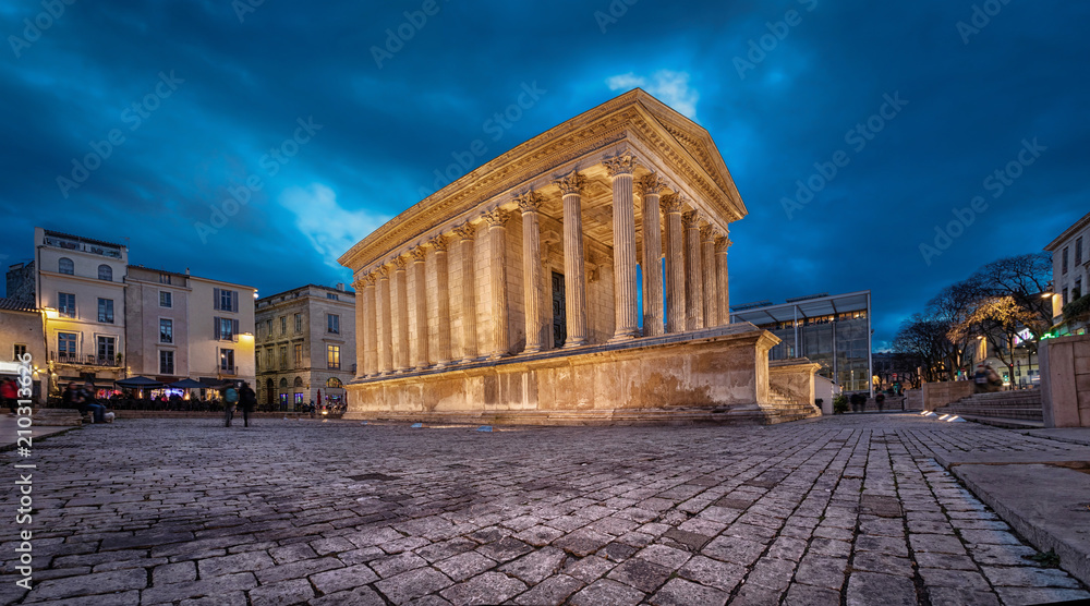 Maison Carree - restored roman temple dedicated to 'princes of youth', with richly decorated columns & friezes in Nimes, France
