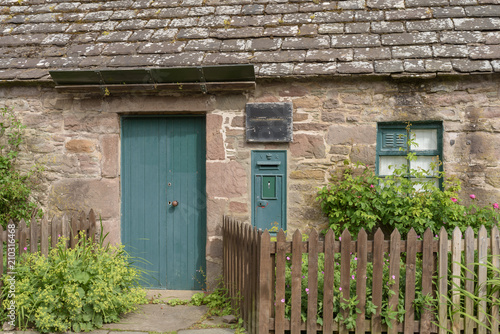 A stone built cottage and former post office in the village of Glamis in Angus, Scotland. photo